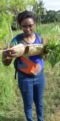 Fiona Njagi carrying a Rabai bag woven with palm leaves