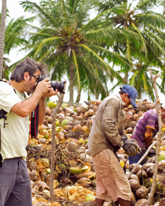 Mauricio Paive taking photos of workers at a coconut plantation in Northeast Brazil. (Photo: Leandro Salles)