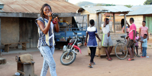 Banda Heritage member Irene Mensah films a gathering in Boase, 2018. (Photo: Ann B. Stahl)