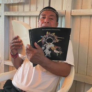 Santiago Belisario with book "The Cashinahua of Eastern Peru," based on the collection held at the Haffenreffer Museum of Anthropology, Brown University. (Photo: Giancarlo Rolando)