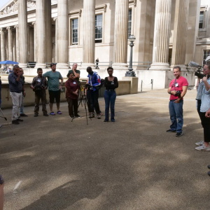 Henrike Neuhaus speaking with EMKP Grantees in front of the British Museum during a workshop on filming and sound at the 2023 EMKP Training. (Photo: Li-Xuan Teo)