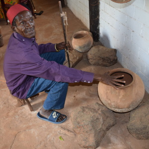 Mr Mwatsuma showing some of the traditional Mijikenda kitchen items
