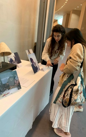 EMKP Grantee Renas Babakir speaking with attendees at the display table for her project, "Documenting the Lost Practices of Kurdish Felt and Felt-making in the Foothills of the Zagros Mountains" (Photo: Li-Xuan Teo)