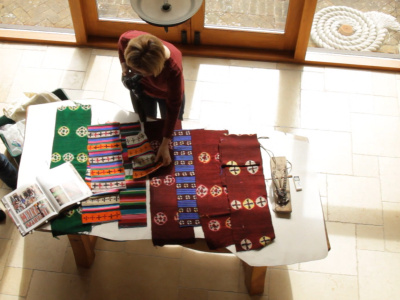 Emma Martin documenting a group of Tibetan textiles in preparation for a donation to National Museums Liverpool’s collections, April 2018 (Photo: Belle Vue Productions)