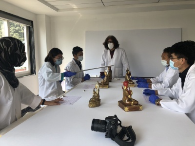 Tibet Museum staff, Kunga Chodon (2nd from left), Tsering Norbu (3rd from left), Karma Tashi (2nd from right) and Tenzin Jinpa (right) undertaking conservation work under the guidance of Nazima Chaudhary and Pankaj Sharma in preparation for the opening of the Tibet Museum in 2021 (Photo: Tibet Museum)