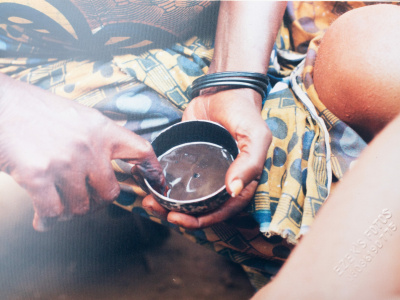 Uli designer preparing Uli liquid for the designing session (Nigeria). Credit: Tracie Utoh-Ezeajugh.