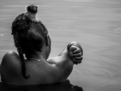 Munduruku woman bathes in stream. Photo: Maurício Torres