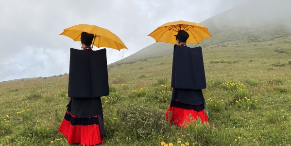 Nuosu woman with yellow umbrella (Photo: Cigui Edi)